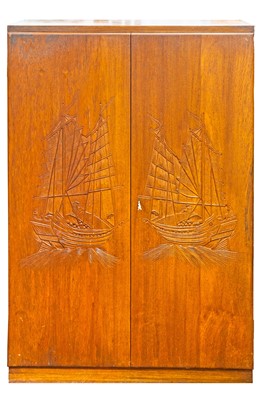 Lot 884 - A Chinese carved teak collectors' cabinet.