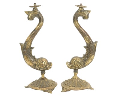 Lot 786 - A pair of heavy brass table lamps cast as dolphins.
