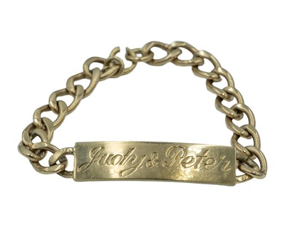 Lot 17 - A heavy 9k hallmarked gold curb-link id bracelet.