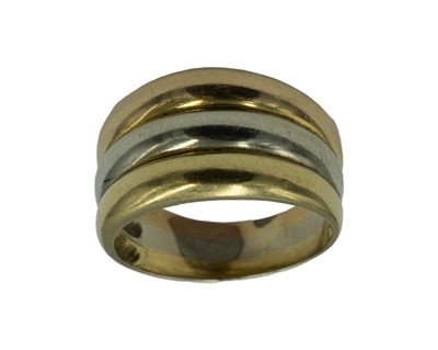 Lot 22 - A continental high-purity tri-colour gold triple band ring.