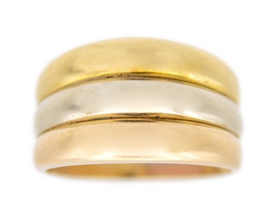 Lot 22 - A continental high-purity tri-colour gold triple band ring.