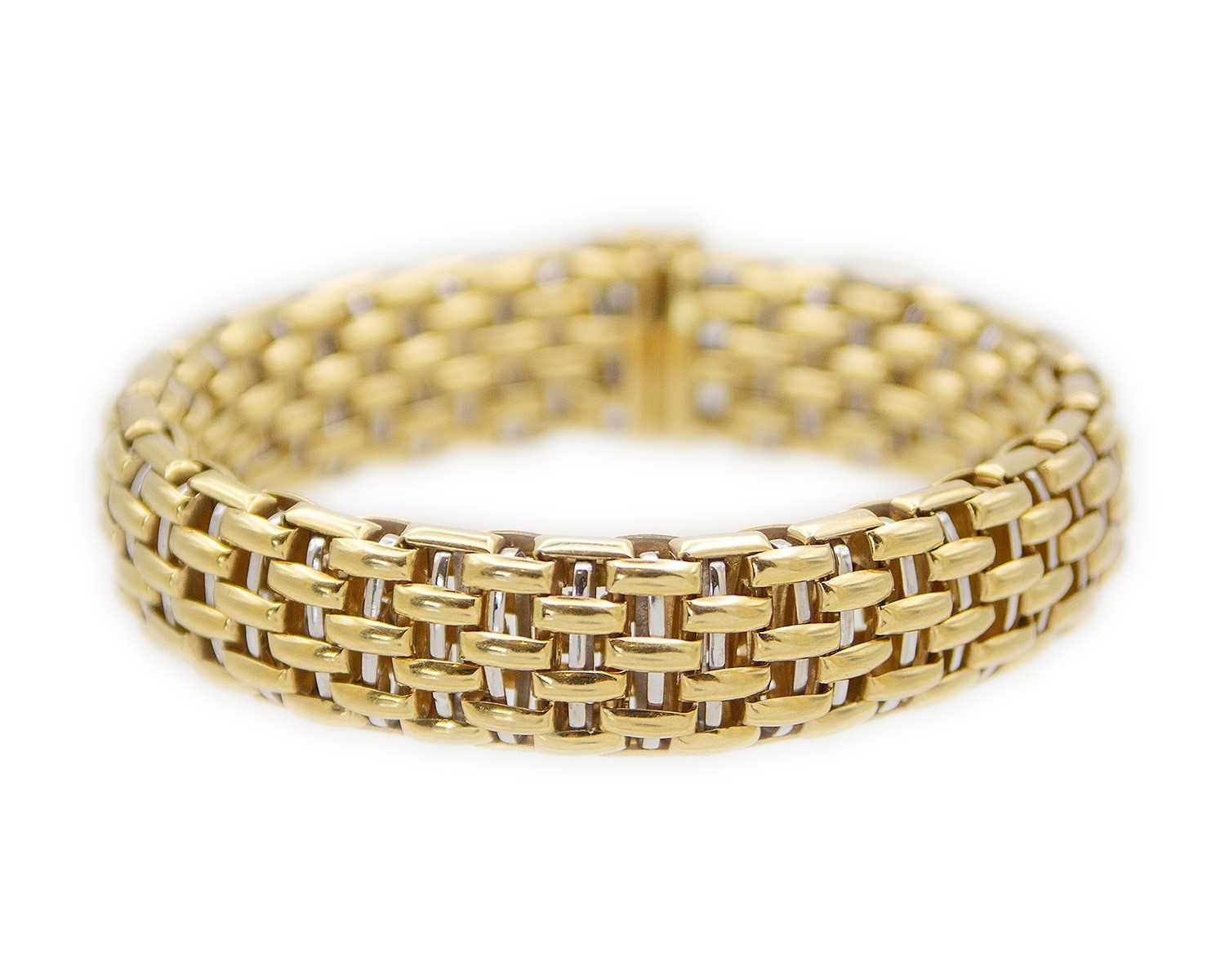 Lot FOPE - An Italian 18k bi-colour gold articulated brick-link bracelet.