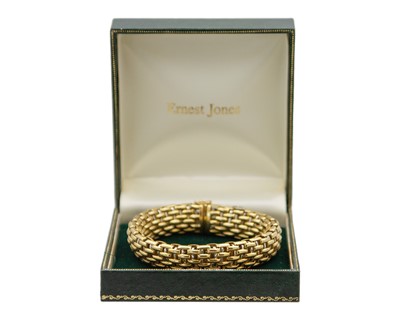 Lot FOPE - An Italian 18k bi-colour gold articulated brick-link bracelet.