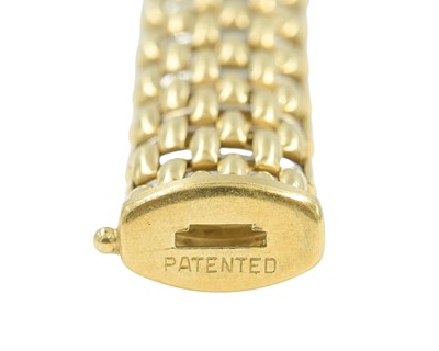 Lot 108 - FOPE - An Italian 18k bi-colour gold articulated brick-link bracelet.