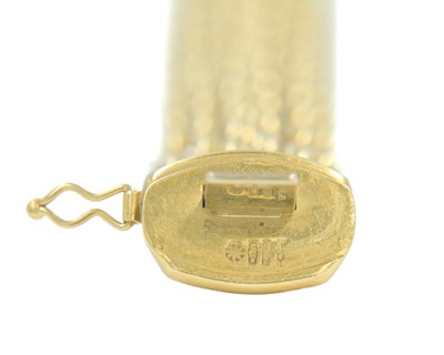 Lot 108 - FOPE - An Italian 18k bi-colour gold articulated brick-link bracelet.