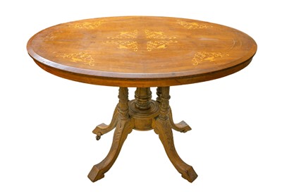 Lot 944 - A Victorian walnut and boxwood inlaid oval table.