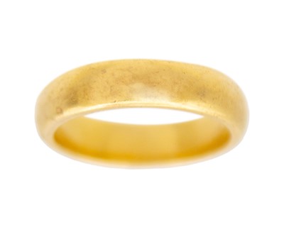 Lot 24 - A 22k yellow gold band ring.