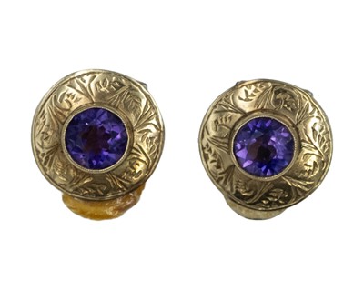 Lot 55 - A pair of amethyst clip earrings, set in yellow gold.
