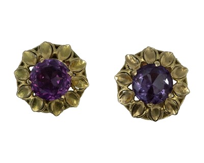 Lot 69 - A pair of purple colour change synthetic sapphire clip earrings, set in high-purity gold.