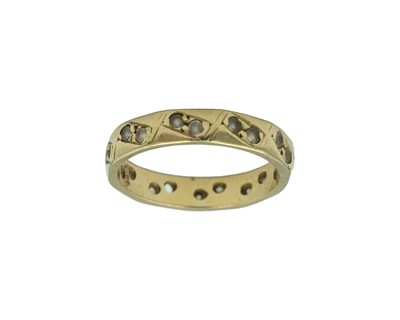 Lot 76 - A yellow gold eternity ring.