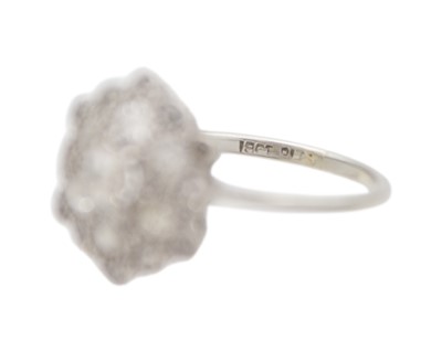 Lot 34 - An early 20th-century old mine-cut diamond cluster ring, set in white metal.