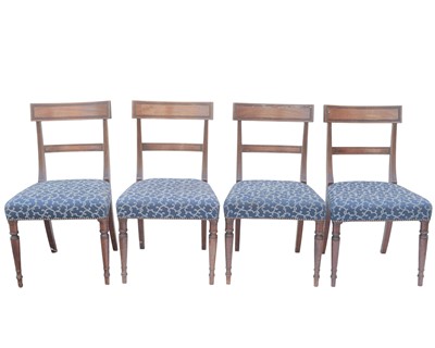 Lot 880 - A set of four George IV mahogany dining chairs.