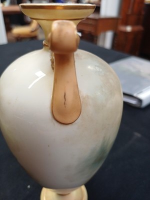 Lot 712 - A Royal Worcester porcelain baluster vase.