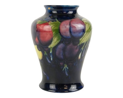 Lot 688 - A Moorcroft Wisteria pattern baluster vase.