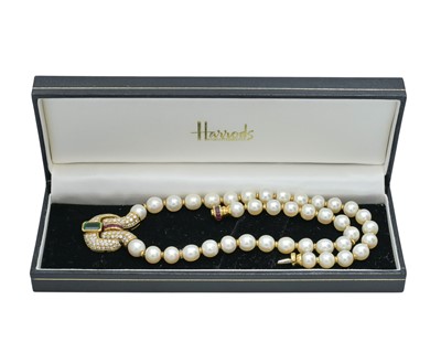 Lot 86 - An impressive pearl necklace, with heavy 18k pavé diamond, ruby & tourmaline set sculptural pendant.