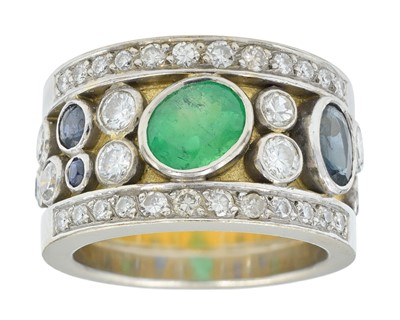 Lot 96 - A fine 18k heavy yellow and white gold, diamond, emerald and sapphire set band ring.