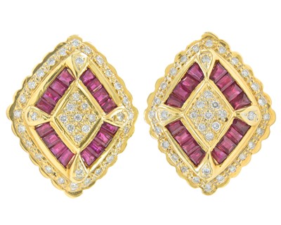 Lot 80 - A pair of high-purity gold diamond and ruby set cufflinks.