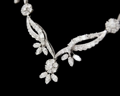 Lot An intricate 18k white gold diamond set floral and leaf design collier necklace