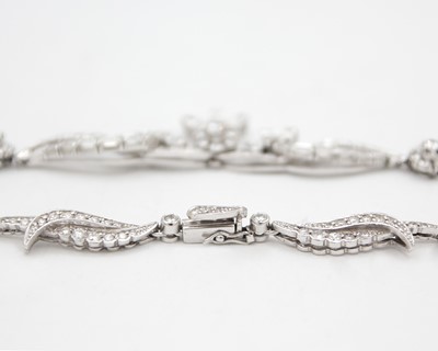 Lot An intricate 18k white gold diamond set floral and leaf design collier necklace
