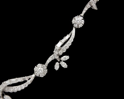 Lot An intricate 18k white gold diamond set floral and leaf design collier necklace
