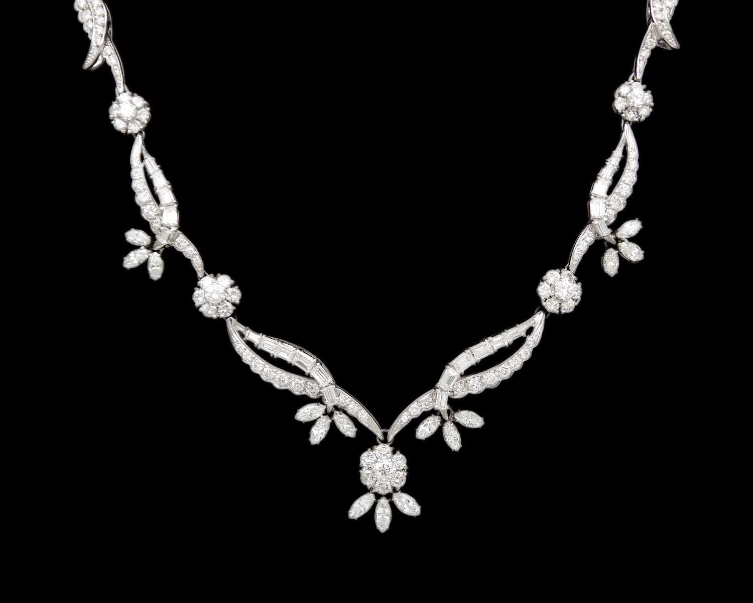 Lot An intricate 18k white gold diamond set floral and leaf design collier necklace