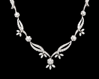 Lot An intricate 18k white gold diamond set floral and leaf design collier necklace