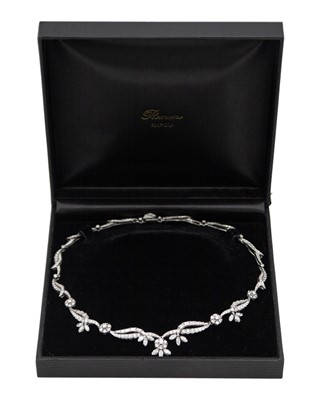 Lot An intricate 18k white gold diamond set floral and leaf design collier necklace