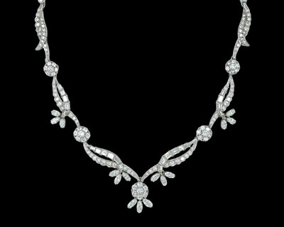 Lot 79 - An intricate 18k white gold diamond set floral and leaf design collier necklace