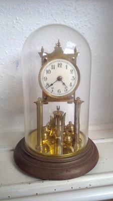 Lot 2917 - A German brass 400 day torsion clock, under a...