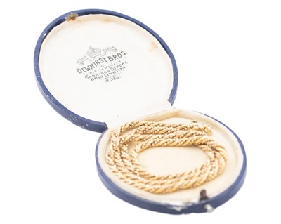 Lot 103 - An Italian 9k yellow gold fancy rope twist necklace.