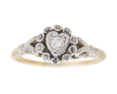Lot 124 - A yellow metal, platinum and diamond-set ring.