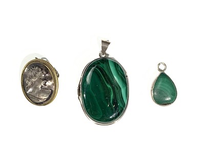 Lot 2514 - Two silver-mounted malachite pendants and a...