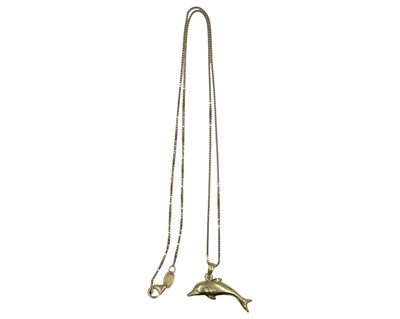 Lot 91 - A 14k yellow gold dolphin pendant and necklace.