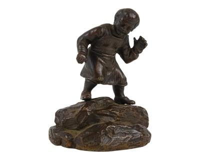 Lot 60 - A small bronze rustic figure.