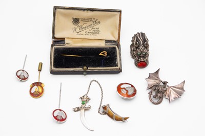 Lot 240 - A selection of silver brooches and a silver ring.