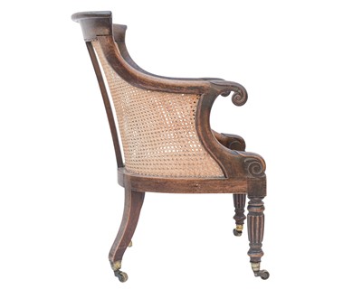 Lot 935 - A Regency rosewood bergere library armchair.