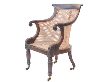 Lot 935 - A Regency rosewood bergere library armchair.