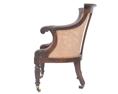 Lot 935 - A Regency rosewood bergere library armchair.