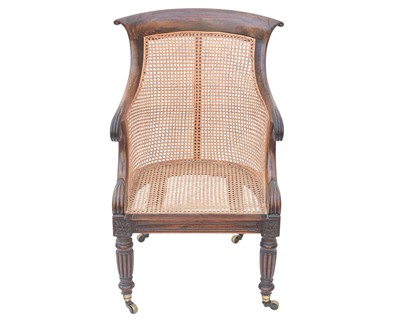 Lot 935 - A Regency rosewood bergere library armchair.