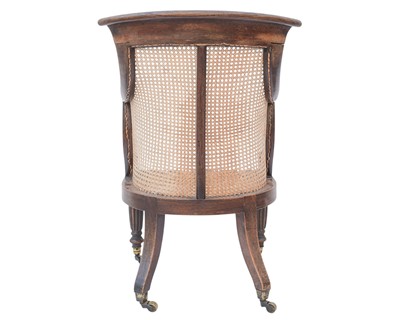 Lot 935 - A Regency rosewood bergere library armchair.