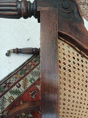 Lot 935 - A Regency rosewood bergere library armchair.