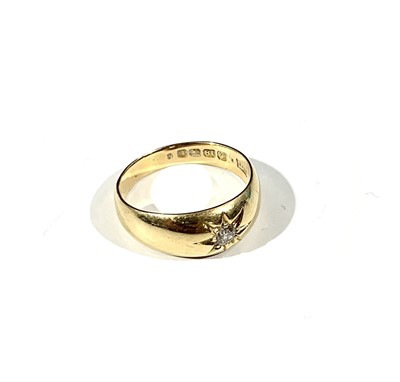 Lot 2465 - An 18ct gold ring gypsy set a diamond 5.8gm