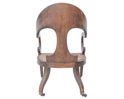 Lot 888 - A Regency simulated coramandel wood 'Roman' open armchair.