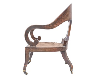 Lot 888 - A Regency simulated coramandel wood 'Roman' open armchair.