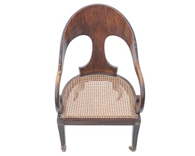 Lot 888 - A Regency simulated coramandel wood 'Roman' open armchair.