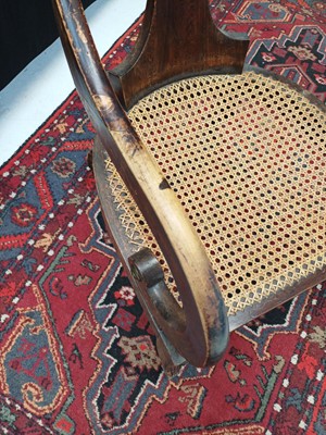 Lot 888 - A Regency simulated coramandel wood 'Roman' open armchair.