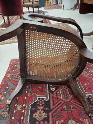 Lot 888 - A Regency simulated coramandel wood 'Roman' open armchair.