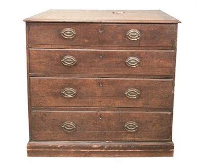 Lot 798 - A George III oak chest of four long drawers.