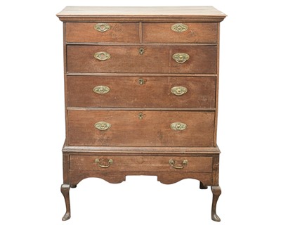 Lot 806 - A George III oak chest on stand.