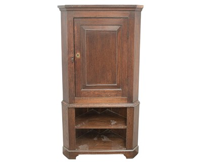 Lot 836 - A late George III oak corner cupboard.
